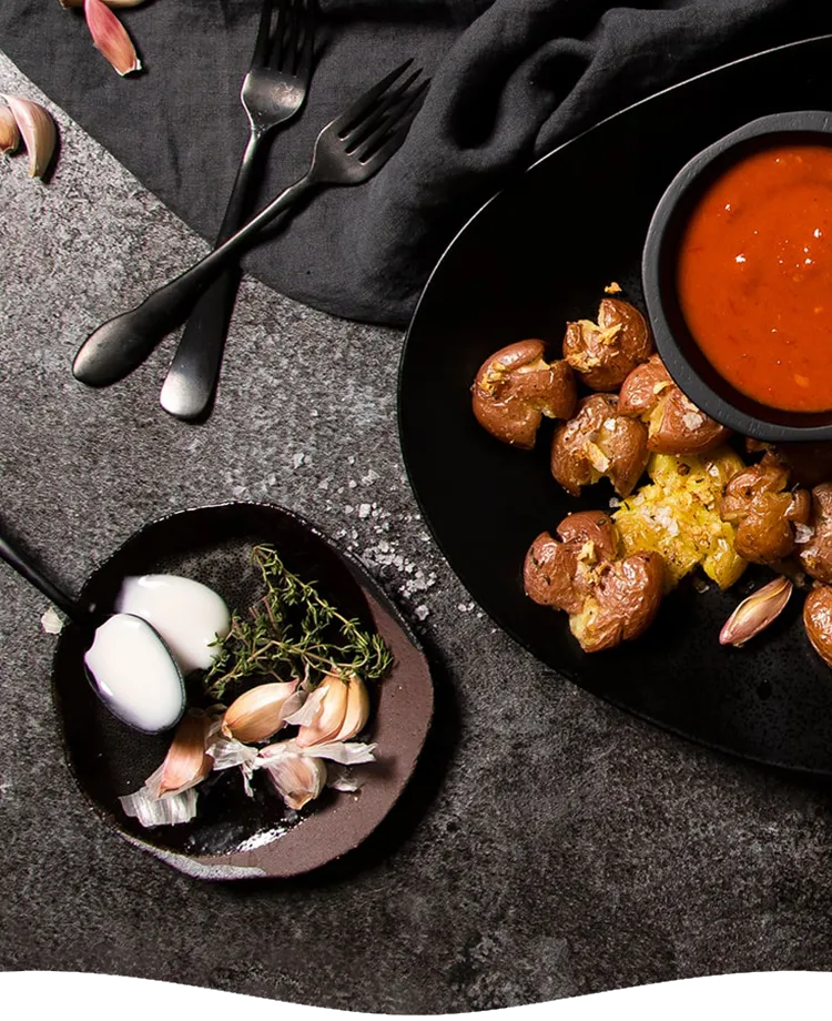 Garlic Smashed Potatoes With Harissa Yogurt Topping